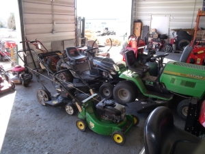 lawn mowers waiting to be repaired
